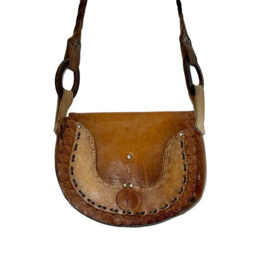 Brown leather geometric dotty embossed hippy style shoulder bag with O-ring attached strap and decorative weaving. 