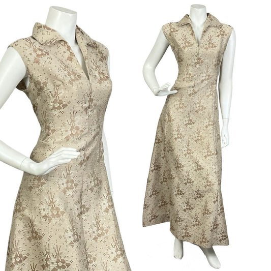 Mannequin wears a vintage 60s 70s sleeveless gold maxi dress with a dagger collar and glittery geometric print. 